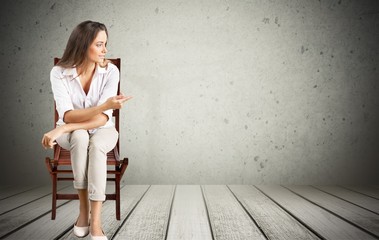 Portrait of a young pretty woman sitting