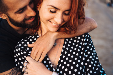 happy young couple posing at the camera