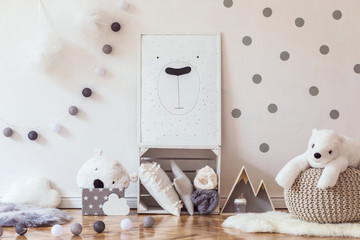 Wall Mural - Stylish scandinavian child room with mock up photo poster frame on the pattern wall, boxes, teddy bear and toys.Cute modern interior of playroom with white walls, wooden accessories and colorful toys.