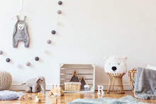 Stylish Scandinavian Child Room With Mock Up Photo Poster Frame On The Pattern Wall, Boxes, Teddy Bear And Toys.Cute Modern Interior Of Playroom With White Walls, Wooden Accessories And Colorful Toys.