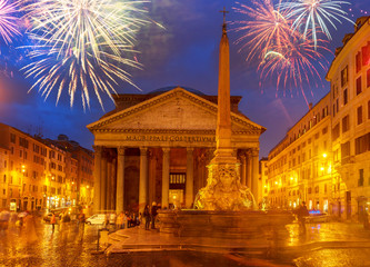 Fototapete - view of ancient Pantheon church in Rome illuminated at blue night with fireworks, Italy