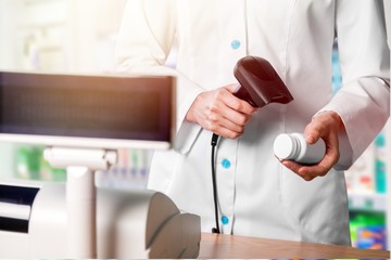 Poster - Pharmacologist sell drug bottle in drugstore