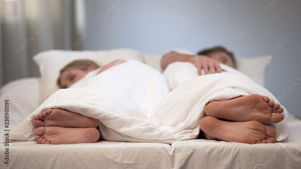 Young Man And Woman Sleeping Back To Back Conflict In Bed