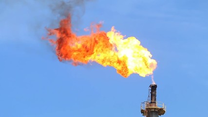 Wall Mural - Fire on flare stack at oil and gas central processing platform release over pressure from process. Petroleum refinery plant