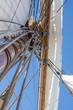 Looking up the mast at the yard, sails, and rigging of a 3-masted schooner on its way to the Island of Nicklösa in the Åland Islands, Finland.