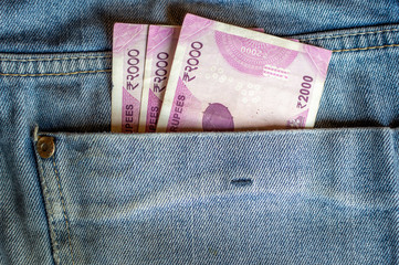 Indian currency Rs 2000 note in the pocket of a denim