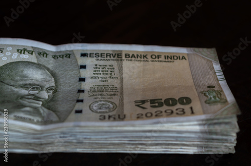 Fotografering A bundle of Rs 500 Indian Currency kept on a table