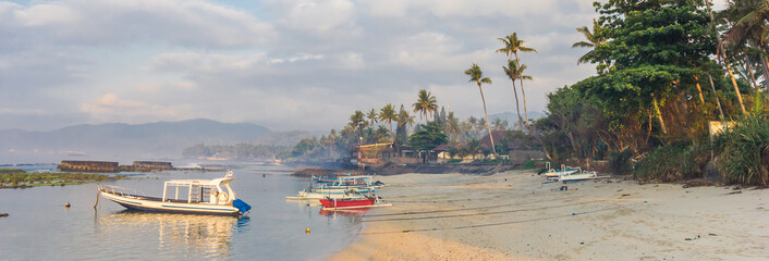 Wall Mural - Panorama of small boats at the coast of Candidasa on Bali, Indonesia