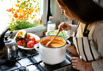 Wall Mural - Woman preparing a pumpkin soup