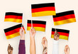 © Rawpixel.com - Hands waving the flags of Germany