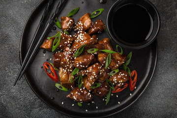 Wall Mural - sweet sticky pork served with chives and  sesame seeds