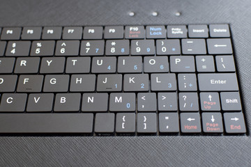 Closeup of black keyboard of tablet. Selective focus.