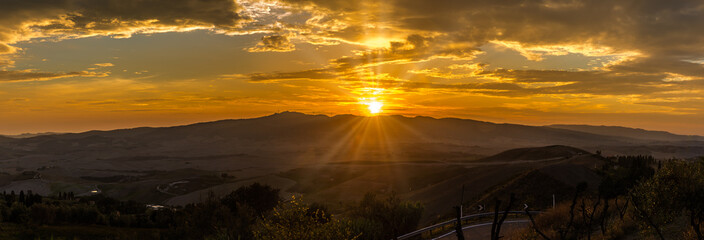 Wall Mural - Panoramic view at the sunset above the Tuscany countryside from Volterra in Italy