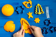 © 13smile - Child making decorations of orange peel for Christmas. Step 2