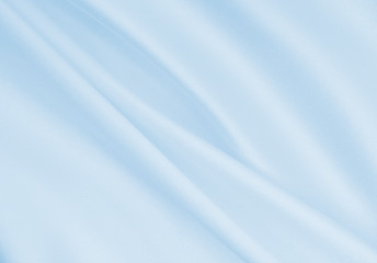 smooth elegant blue silk or satin luxury cloth texture as abstract background. luxurious background 