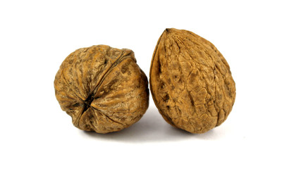 two walnuts isolated on white background macro