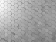 © kugelwolf - Beautiful abstract shiny light and wall background honeycomb in grey color