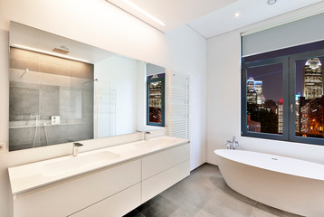 Sticker -  Bathtub in corian, Faucet and shower in tiled bathroom