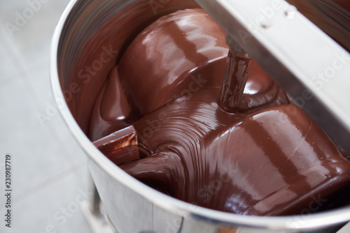 Fotografía Chocolate being mixed in a stainless steel mixer