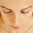 © Olesia - Female face with closed eyes, perfect skin, without make-up