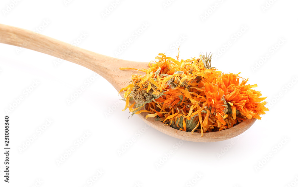 Wooden spoon with dried calendula flowers on white background