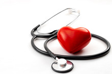 Yearly Health Check Up, Disease Diagnosis Medicine, Healthcare And Cardiology Concept With A Red Heart And A Stethoscope Isolated On A Hospital White Background