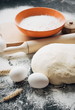 © Yulia - Dark Baking background with white eggs and flour.Dark blue background with a wooden spoon flour,eggs, flour and rolling pin. The process of baking, cooking.Top view, space for text.