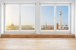 © hanohiki - Berlin skyline through terrace windows - modern penthouse apartment  room