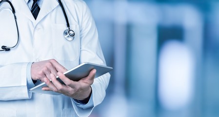 Poster - Close-up Doctor at hospital working with tablet pc