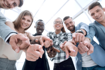 Business people pointing at the camera isolated on white