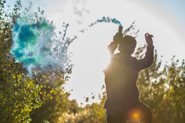 young man have fun with smoke fire cracker f