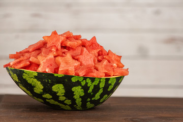 Wall Mural - Watermelon slices in the shape of a star in bowl on a dark wooden background