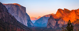 Yosemite National Park Tunnel View overlook at sunset. Front view panorama of popular El Capitan and Half Dome at deep red sunset. Summer american holidays. California, United States.
