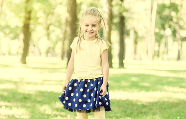 cute little girl have a fun in the morning park