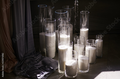 Tall Glass Vases With White Candles Stand On The Floor Buy This