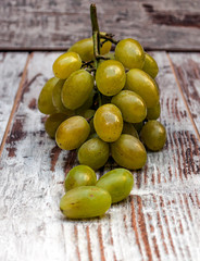 Grapes surrounded by rustic background