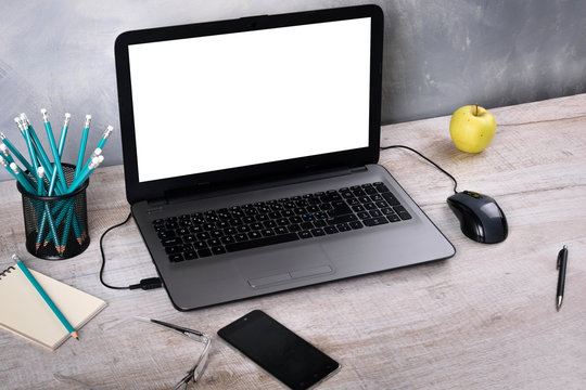 Workspaces mock up Laptop on wood table with glass phone smartphone pencil apple notebook mouse desk with copy space for graphics or products display montage.Working place of designer,close-up Office.
