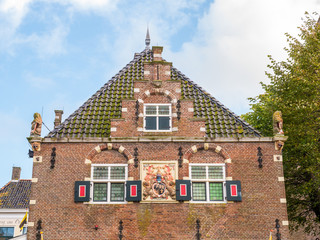 Wall Mural - Facade of old weigh house in downtown Workum, Friesland, Netherlands