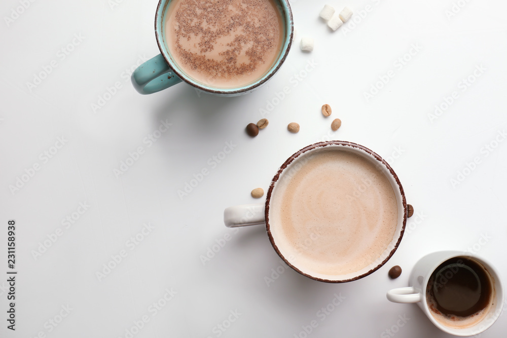 Cups with tasty aromatic coffee on white background