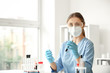 © Pixel-Shot - Female doctor working with blood samples at table in laboratory