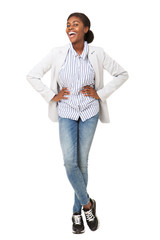 Wall Mural - Full body attractive young black woman in blazer smiling against isolated white background