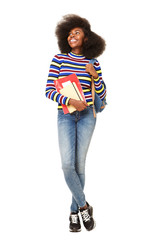 Full body black female student smiling against isolated white background with books and bag