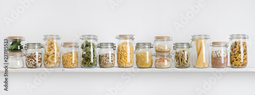 Plakaty do kuchni assortment-of-uncooked-groceries-in-glass-jars-arranged-on-shelf