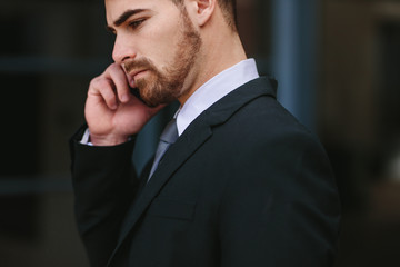 Wall Mural - Businessman talking over mobile phone