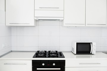 Modern kitchen interior with electric and microwave oven