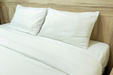 Fototapeta  - White pillows on a bed Comfortable soft pillows on the bed