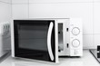 © VAKSMANV - Image of the microwave oven. Modern microwave. Front view.