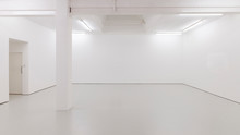 A View Of A White Painted Interior Of An Empty Room Or An Art Gallery With A Skylight Lighting And Concrete Floors