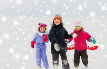 Childhood, Leisure And Season Concept - Group Of Happy Little Kids In Winter Clothes Playing Outdoors