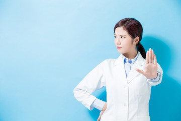 Wall Mural - woman dentist show stop gesture